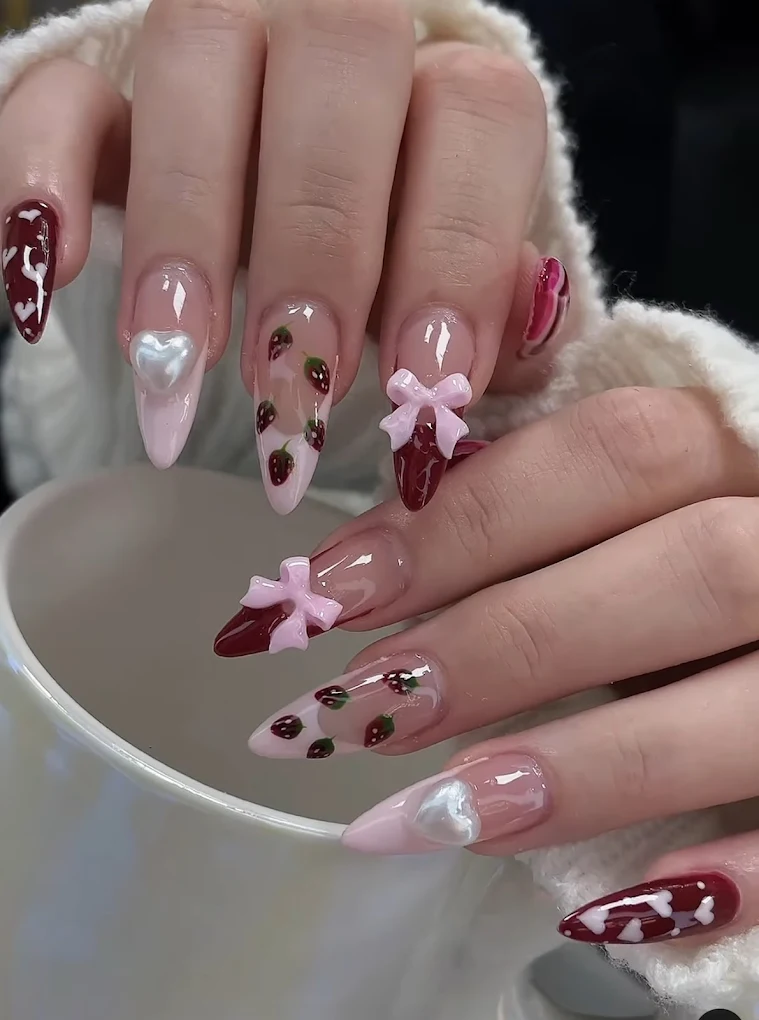 Nude nails with strawberry and 3D bow accents